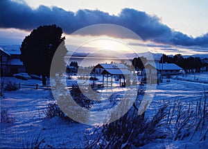 Argentina Bariloche picturesque sunset of a snowy valley with house lake Nahuel Huanpi city