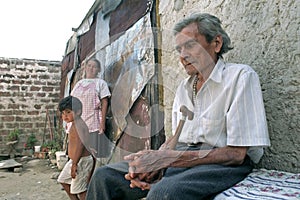 Portrait of old sick Argentine man with family