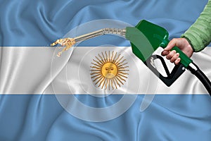 ARGENTINA flag Close-up shot on waving background texture with Fuel pump nozzle in hand. The concept of design solutions. 3d