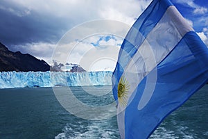 Argentina Flag in front of the Perito Moreno Glacier