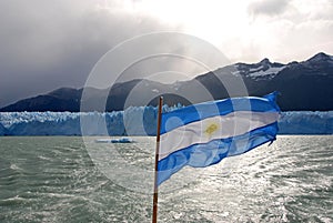 Argentina flag by Perito Merino Glacier in Patagonia