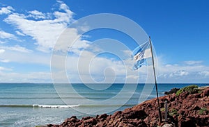 Argentina flag on a sea shore