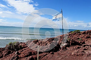 Argentina flag on a sea shore