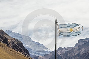 Argentina flag waving with Aconcagua mountain and Andes behind