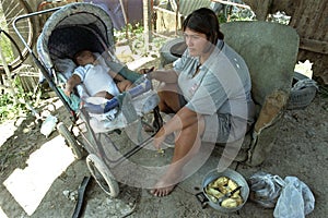 Argentine Mother with child lives in great poverty