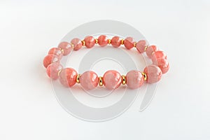 Argentina Rhodochrosite Bracelet with Gold Findings Isolated on White