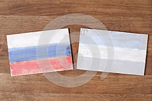 Argentina and Russia flag, concept cooperation friendship on wood background.