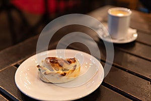 Empanada on Plate with coffee photo