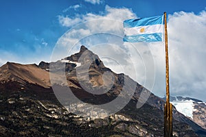 Argentine flag flying in front of the mountain photo