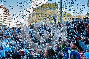 Argentine football fans celebrate their 2010 World Cup victory over Greece in front of a huge screen