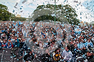 Argentine football fans celebrate their 2010 World Cup victory over Greece in front of a huge screen