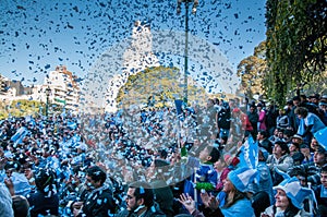 Football fans celebrate their 2010 World Cup victory over Greece in front of a huge screen