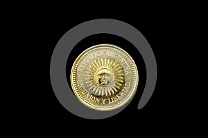 Argentine Gold Five Centavo Coin Isolated On Black photo