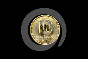 Argentine Gold Ten Centavo Coin Isolated On Black photo