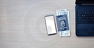 Argentine passport and boarding pass with smartphone with copy space on wooden table photo