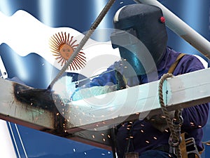 Argentine welder with his flag in the background photo