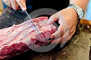 Argentinean raw beef steak meat is cut, sliced