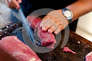 Argentinean raw beef steak meat is cut, sliced