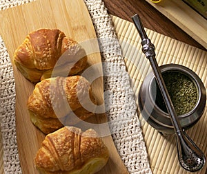 Argentinian breakfast. Croissants and yerba mate in still life