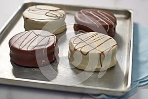 Argentinian homemade chocolate alfajores filled with dulce de leche