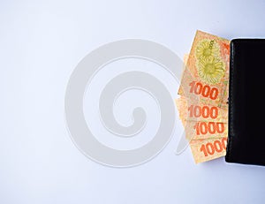 Argentinian money with white background photo