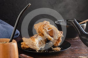 Argentinian pastelito cut in half where you can see the sweet potato candy inside photo