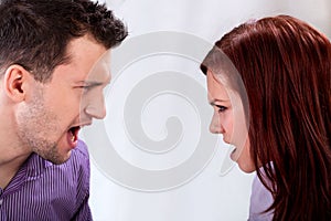 Arguing couple on isolated background