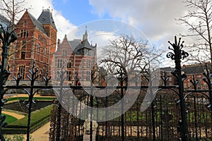 Arhitecture of Amsterdam. Rijksmuseum, Garden of famous dutch national museum. Garden alleys and shod fancing.