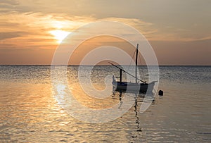 Ari atoll Maldives sunset with boat in Silhouette