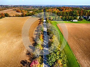 Arial veiw of rural road, fields and autumn trees. photo