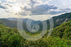 Arial view of the Highway to tunnel in South Korea among high mountain.