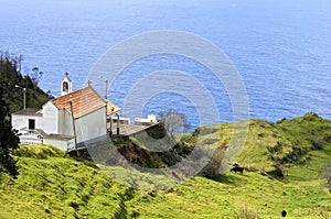 Arial view of Madeira chapel, alp and Atlantic Ocean photo