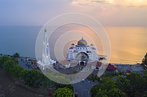 Arial view of Majestic Malacca Straits Mosque during sunset.