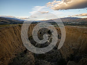 Arid barren badland, wild west desert landscape of Bannockburn Sluicings in former goldmine in Central Otago New Zealand