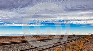 Arid Country Landscape with Rail Lines and Clouds in Olary, Outback Australia