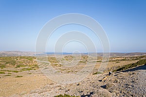 The arid countryside among the mountains , in Europe, Greece, Crete, towards Sitia, By the Mediterranean sea, in summer, on a