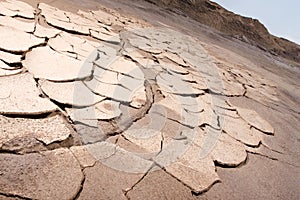 Arid cracked earth photo