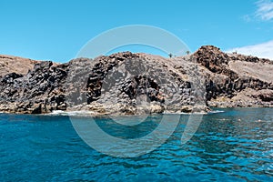 Arid mountains next to the sea