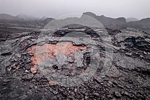 Arid and reddish landscape of the rocks and terrain within the Sierra Negra volcano on Isabela Island, Galapagos