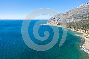 The arid rocky coast and its green countryside, in Europe, in Greece, in Aetolia Acarnania, towards Patras, by the Ionian Sea, in