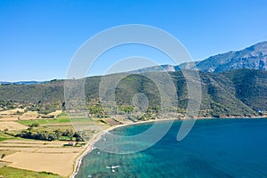 The arid rocky coast and its green countryside, in Europe, in Greece, in Aetolia Acarnania, towards Patras, by the Ionian Sea, in