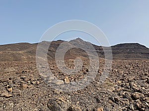 Arid, volcanic landscape of the southern side of Jandia Nature Reserve, Jandia Peninsula, Fuerteventura, Spain