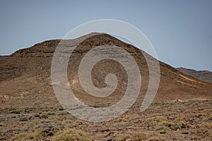 Arid, volcanic landscape of the southern side of Jandia Nature Reserve, Jandia Peninsula, Fuerteventura, Spain