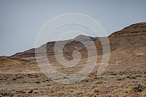 Arid, volcanic landscape of the southern side of Jandia Nature Reserve, Jandia Peninsula, Fuerteventura, Spain