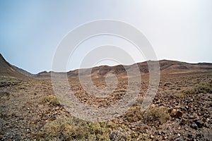 Arid, volcanic landscape of the southern side of Jandia Nature Reserve, Jandia Peninsula, Fuerteventura, Spain