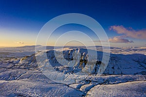 Ariel Shot of penyghent covered in snow