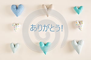 Arigato - Thank you in Japanese language with blue heart cushions photo