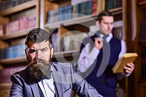 Aristocracy and retro concept. Man with beard and strict face photo