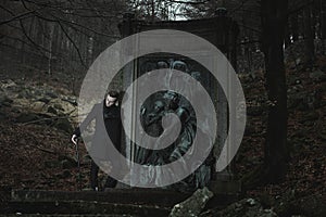 Aristocratic vampire and graveyard statue