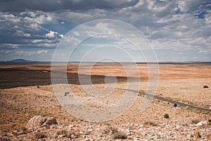 Arizona Desert Landscape with Long Road and Mountain Silhouette